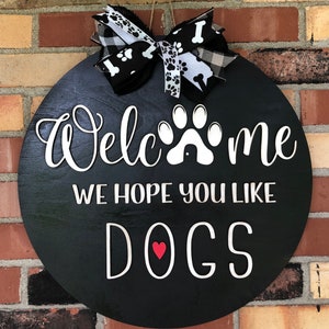 Dog Lovers Welcome We hope you love Dogs Round Wooden sign!