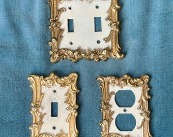 Copriinterruttori/prese decorati in stile Mid-Century Modern: metallo oro e crema, anni '50-'70