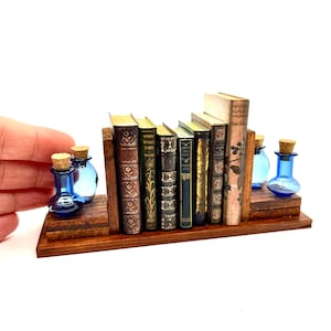 1:6 scale miniature bookshelf with blue bottles and (optional) 7 miniature books,  dollhouse library accessories