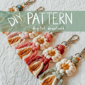 May include: Macrame keychains in various colors, including pink, orange, and cream, with a daisy-like design. Each keychain has a silver-colored clasp. The text "DIY PATTERN digital download" is visible in the image.