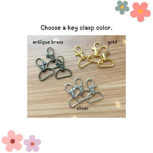 May include: Three sets of key clasps in antique brass, gold, and silver. Choose a key clasp color.