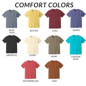 May include: A chart of 12 different colored t-shirts, each with a name underneath. The colors are: Blue Jean, Butter, Chili, Grape, Graphite, Ivory, Hemp, Lagoon Blue, Watermelon, Yam.