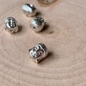 Buddha head beads light silver