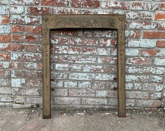 Antique Architectural Salvage cast iron fireplace surround.