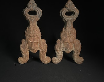 Antique cast iron andirons.