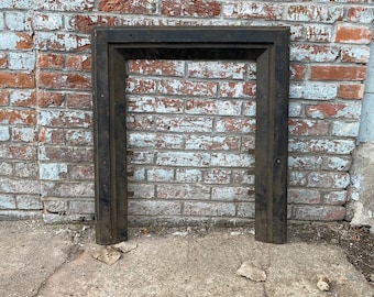 Antique Architectural Salvage cast iron fireplace surround.