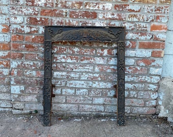 Antique Architectural Salvage cast iron fireplace surround.