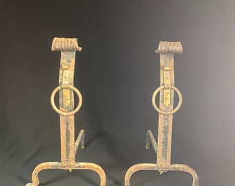 Hand forged wrought iron andirons with brass fixtures.