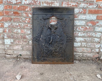 Antique Architectural Salvage cast iron fireplace cover.