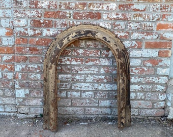 Antique Architectural Salvage cast iron fireplace surround.