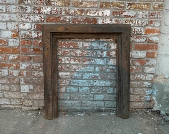 Antique Architectural Salvage cast iron fireplace surround.