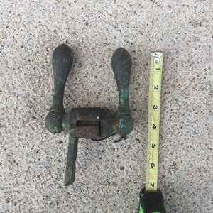 May include: A vintage, green metal door handle with two round knobs and a lever. The handle is about 7 inches long.