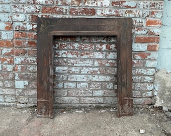 Antique Architectural Salvage cast iron fireplace surround.