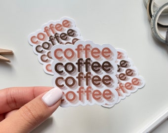 May include: A set of five stickers with the word "coffee" repeated in a gradient of brown, orange, and pink colors. The stickers are layered on top of each other, creating a 3D effect.