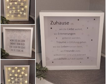 Cornice con detto A casa illumina le stelle