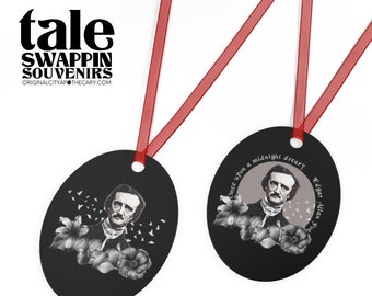 May include: Two black oval ornaments with red ribbon. One ornament features a black and white illustration of Edgar Allan Poe with the text "Once upon a midnight dreary." The other ornament features a black and white illustration of Edgar Allan Poe with flowers and birds.