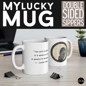 May include: White ceramic mug with a black quote on one side: "The soul is silent. If it speaks at all, it speaks in dreams." - Louise Gl&uuml;ck. The other side features a colourful image of a person's face with text in the background.
