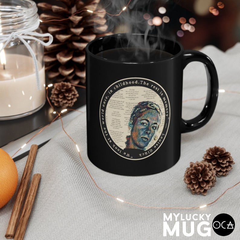 May include: Black ceramic mug with a white circle design featuring a portrait of a person and the text "We look at the world once, in childhood. The rest is memory."  "Louise Gl&uuml;ck"