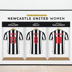 May include: A black and white striped soccer jersey with the name "SOULSBY" and the number "19" on the back.  The jersey is hanging on a hanger in a locker room.  The text "2023-2024 CHAMPIONS NEWCASTLE UNITED WOMEN" is at the top of the image.
