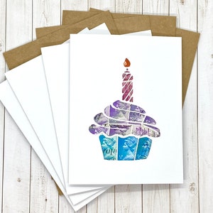 May include: Set of five blank greeting cards with a colorful cupcake design made from postage stamps. The cupcake has a single candle on top. The cards are perfect for birthdays.