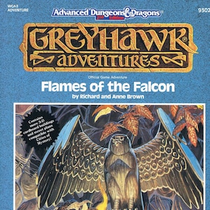 May include: A Greyhawk Adventures game book cover featuring a brown falcon with outstretched wings perched on a flaming pillar. The title is "Flames of the Falcon" by Richard and Anne Brown. The cover is blue with a white border.