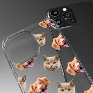 May include: A clear phone case with a repeating pattern of a brown dog and a gray cat. The dog and cat are looking at the camera. The case is designed to fit an iPhone.
