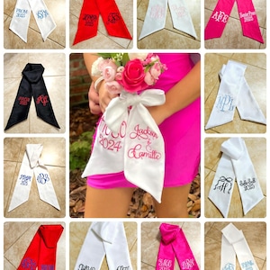 May include: Collage of satin sashes in various colors, including white, red, black, and pink. Each sash is embroidered with text and monograms, such as "PROM 2025" and initials. Some sashes are held by a person wearing a pink dress.
