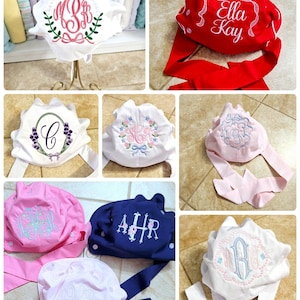 May include: A collage of nine images showcasing various styles of personalized surgical caps. The caps are made of white, pink, blue, and red fabric and feature embroidered monograms, names, and floral designs.