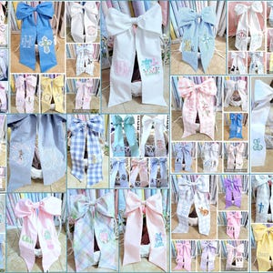May include: A collage of decorative hair bows in various colors, including white, blue, pink, and yellow. Many bows feature embroidered designs such as crosses, bunnies, and floral patterns. Some bows have monogrammed initials.
