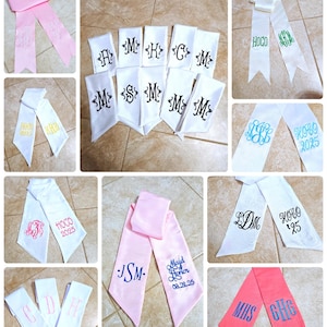 May include: A collage of personalized sashes in various colors, including pink and white. The sashes feature embroidered initials, names, and dates. Some sashes have the text "HOCO" and "2025".