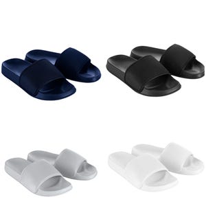 May include: Three pairs of slides in navy blue, black, and white. The slides are made of a soft, comfortable material and have a simple, stylish design.
