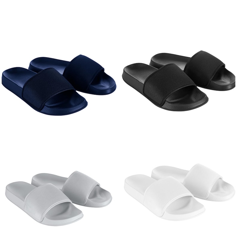 May include: Three pairs of slides in navy blue, black, and white. The slides are made of a soft, comfortable material and have a simple, stylish design.