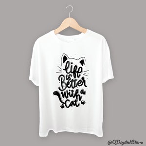 May include: White t-shirt with a black cat graphic and the text "life is better with a cat".