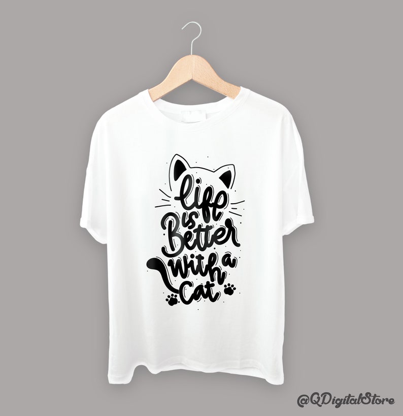 May include: White t-shirt with a black cat graphic and the text "life is better with a cat".