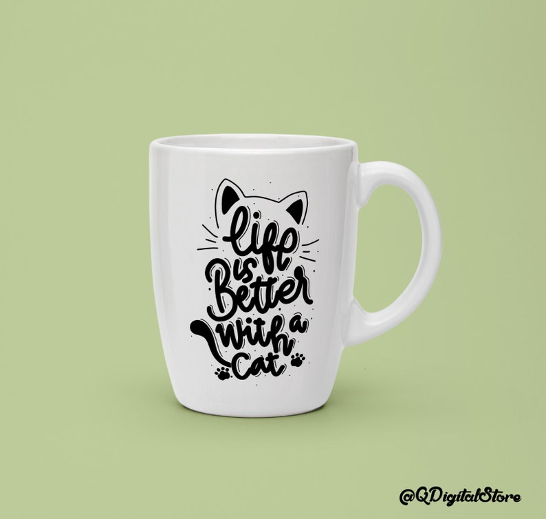 May include: White ceramic mug with a black cat silhouette and the text "life is better with a cat" in a handwritten font.