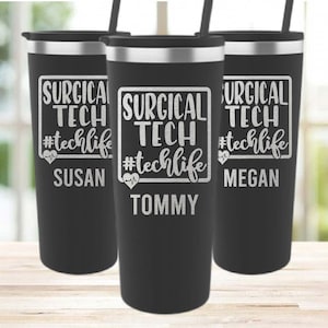 May include: Three black stainless steel tumblers with a silver inscription that reads "Surgical Tech #techlife" with a personalized name below. The names are Susan, Tommy, and Megan.