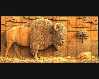 May include: A detailed wooden carving of a bison in a natural landscape. The artwork features a large bison with detailed fur, standing in a field with a tree, rocks, and clouds. The carving is in shades of brown.
