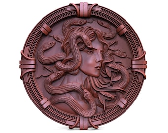 May include: A round, brown, wooden plaque with a detailed carving of Medusa, a mythical Greek figure with snakes for hair. The plaque has a decorative border.