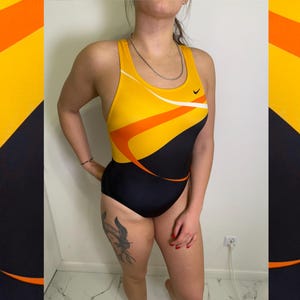 nike yellow bodysuit