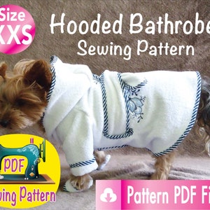May include: A small dog wearing a white hooded bathrobe with blue trim and floral embroidery. The image includes text that reads "Hooded Bathrobe Sewing Pattern" and "Pattern PDF Files". A sewing machine graphic is also present.