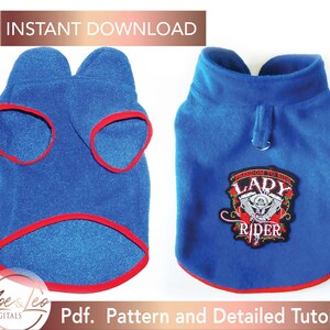 May include: A blue fleece dog sweater with red trim and a red, white, and black embroidered patch that says "Freedom to Ride Lady Rider".