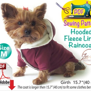 May include: A small dog wearing a burgundy hooded fleece-lined raincoat. The coat has a cream-coloured fleece lining and a size M label. The image includes text that says "PDF Sewing Pattern" and "Girth 40 cm".