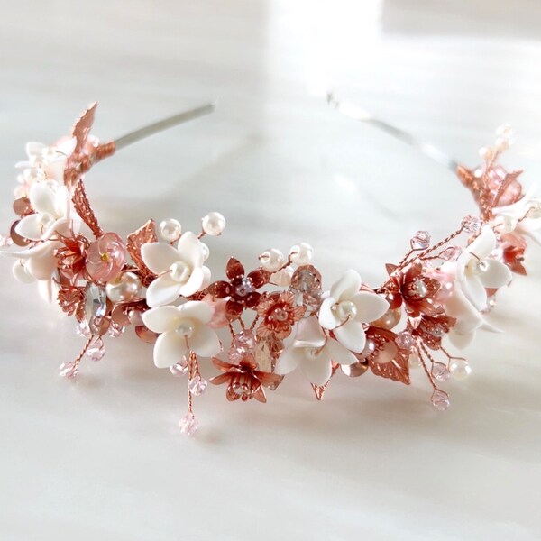 Blush pink bridal headband with white porcelain flowers and rose gold leaves