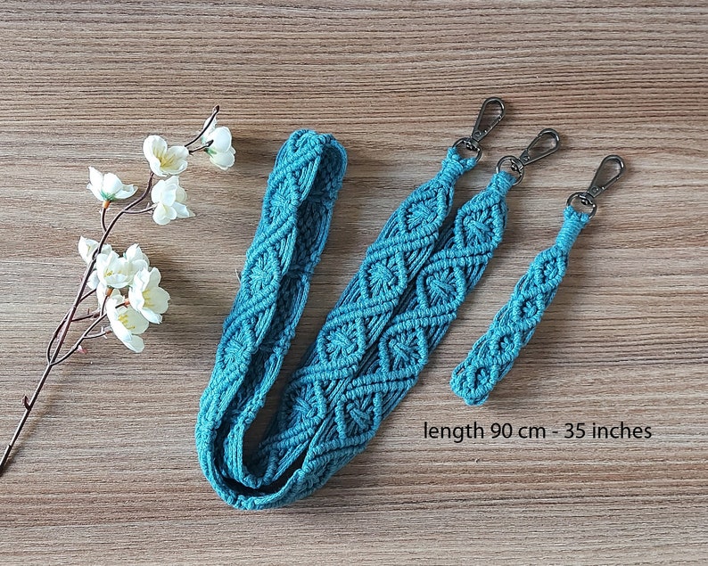 May include: Teal blue macrame strap with silver clasps. The strap is 35 inches long and has a diamond pattern.  length 90 cm - 35 inches