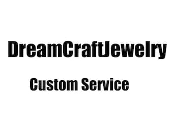 May include: Black text on a white background reads "DreamCraftJewelry" above "Custom Service". The text is in a bold, sans-serif font, suggesting a jewelry business offering custom design services.