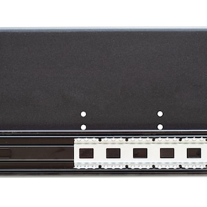 May include: Black metal drawer slide with a white plastic track. The slide is designed for use in furniture.
