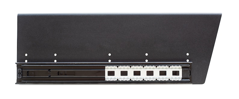 May include: Black metal drawer slide with a white plastic track. The slide is designed for use in furniture.