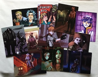 May include: A collection of colorful art prints featuring various illustrations. The prints showcase diverse characters and scenes, with a comic book style and a range of artistic styles. The prints are arranged on a white surface.