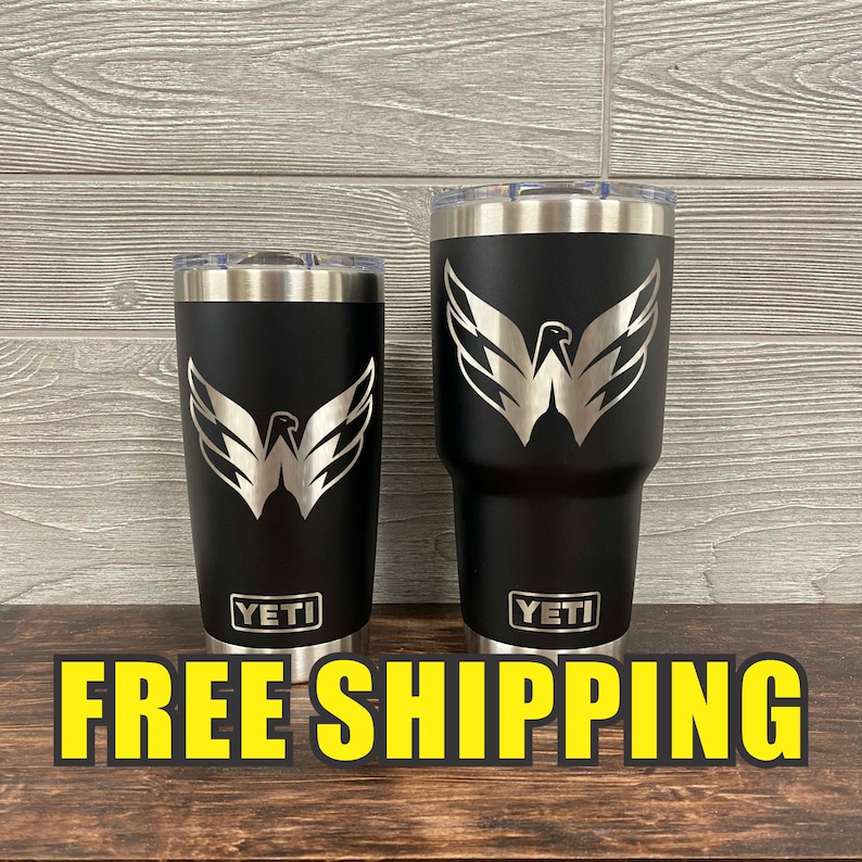 May include: Two black YETI tumblers with a silver eagle logo on each. The larger tumbler is 30 ounces and the smaller tumbler is 20 ounces. FREE SHIPPING is written in yellow letters at the bottom of the image.