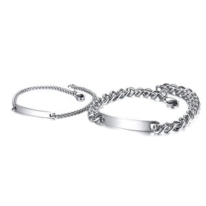 May include: Two silver-toned metal bracelets featuring polished rectangular identification plates. The smaller bracelet has a delicate chain, while the larger bracelet consists of thicker, interlocking curb links. Both pieces include a lobster claw clasp.